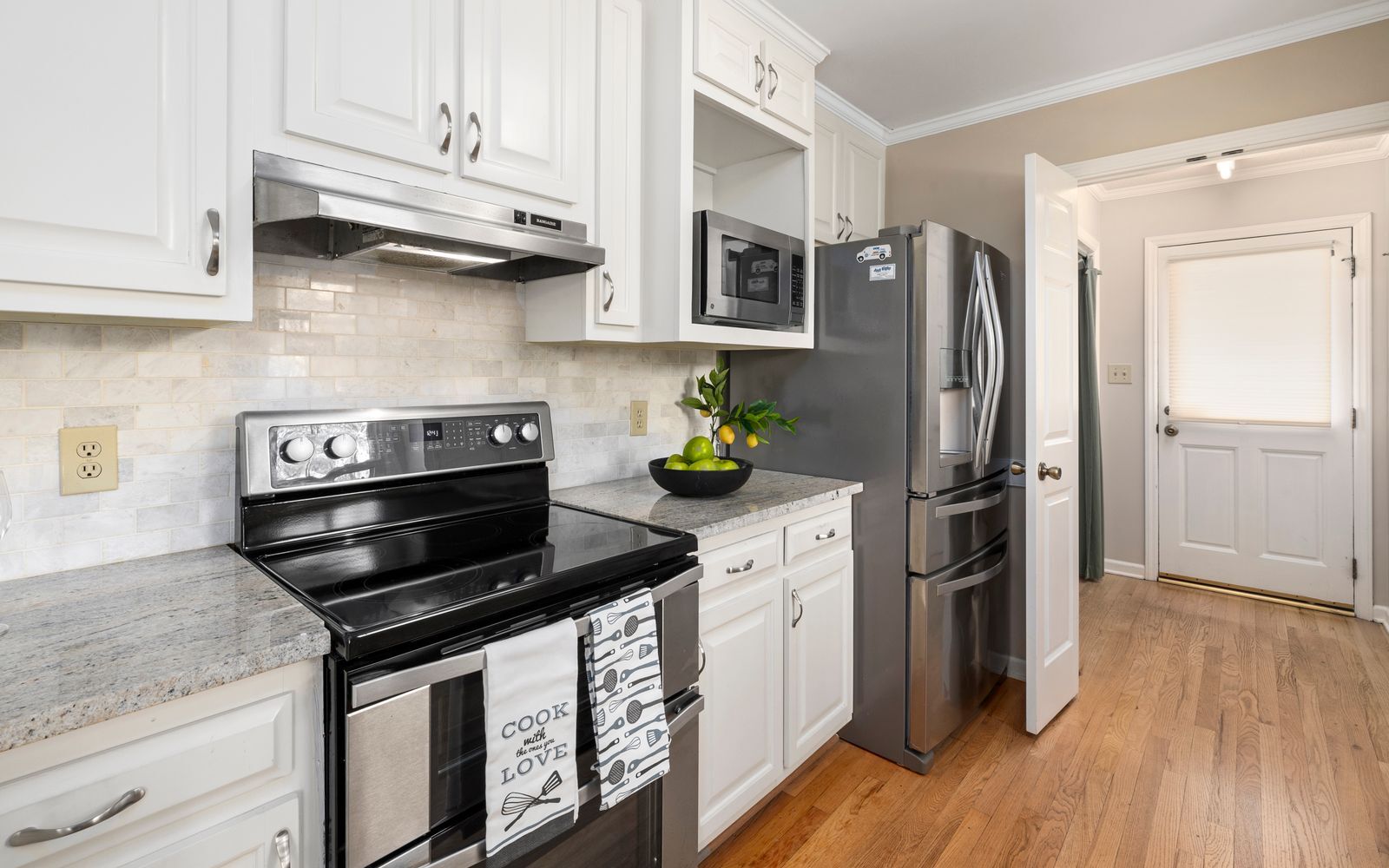 Range Repair Dallas &ndash; Range repair Dallas technician servicing a stainless steel electric range